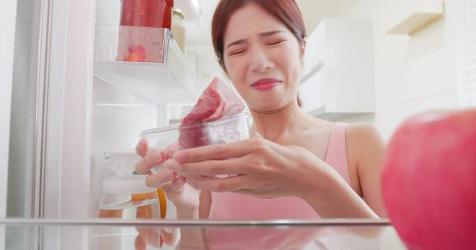 woman open refrigerator