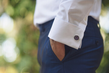 Detail of elegant man's suit with hand in pants pocket