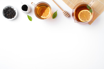 Design concept top view of honey black tea with lemon and mint.