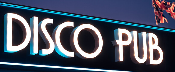 Illuminated signboard of disco pub