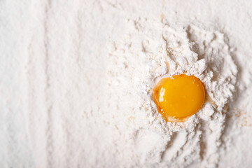 top view eggs, dough, flour  on black table background