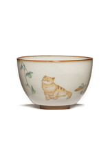 Subject shot of white teabowl with craquelure and hand-painted ginger cat under plum tree. Fine ceramic bowl with Japanese design is isolated on the white background.