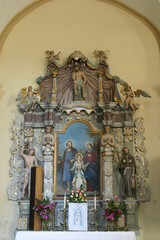 Fototapeta na wymiar Altar of the Holy Family at St. Catherine of Alexandria Church in Samarica, Croatia