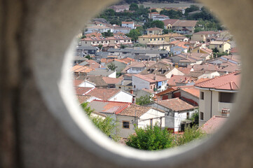 View of the houses of a village from a circular window