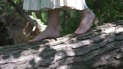 The girl walking along a forest road