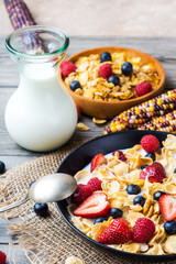 cornflakes with strawberries, blueberries and raspberries