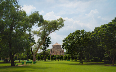 Fototapeta na wymiar Bara Gumbad or big dome in Lodi Gardens, Delhi, India.