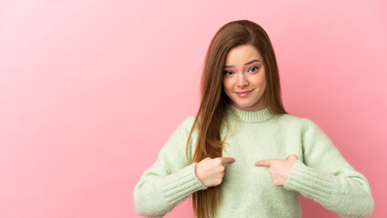Fototapeta premium Teenager girl over isolated pink background pointing to oneself