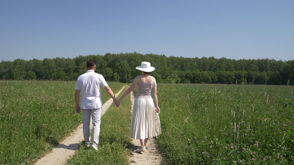 Lovers walk in the field