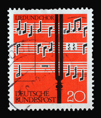Stamp printed in Germany shows Notes and Tuning Fork, Issued to show appreciation of choral singing. The music is from the “Musae Sioniae” by Michael Praetorius, circa 1962