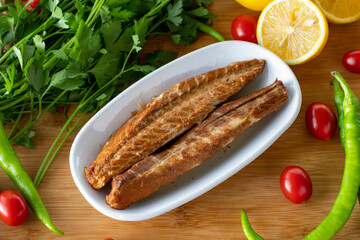 Fillet mackerel on wooden background. Seafood dishes. local name isli uskumru