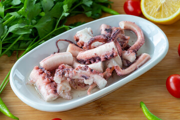 Octopus salad on wooden background. seafood dishes. Local name ahtapot salatası