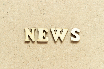 Alphabet letter in word news on wood background