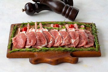 Lamb chops on wooden background