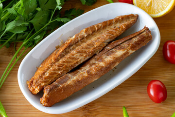 Close-up fillet mackerel on wooden background. Seafood dishes. local name isli uskumru