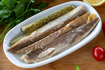 Close-up fillet mackerel on wooden background. Seafood dishes. local name isli uskumru