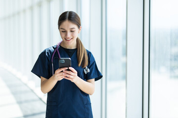 Young female Doctor use the cell phone in hospital. concept of medical worker