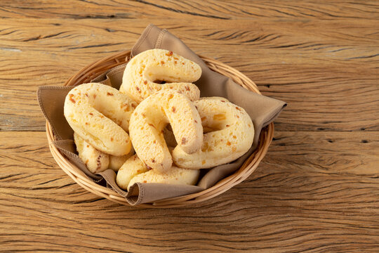 Chipas, typical south american cheese bun in a basket over wooden table