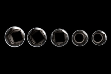 Five socket heads isolated on black background closeup. Top view. Beautiful photo for a poster in a...