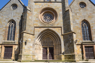 Obraz premium Front facade with arch of the historic Vitus church in Meppen, Germany