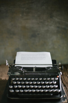 Vintage typewriter on wooden table