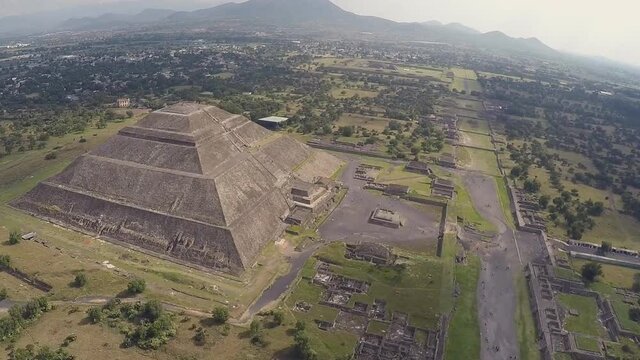 the world's third largest pyramid, the pyramid of the Sun in Teotihuacan with ruin walls in the foreground on a rare smog free day (aerial photography)