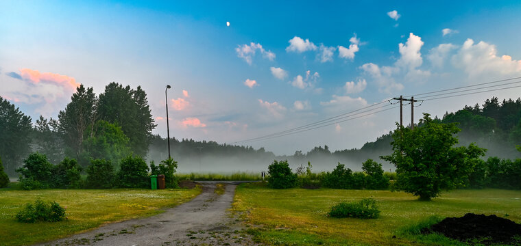 late evening sky mist and lawn in june © Jonas