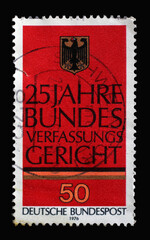A stamp printed in Germany shows German Eagle, 25th Anniversary of Federal Constitutional Court in Karlsruhe, circa 1976