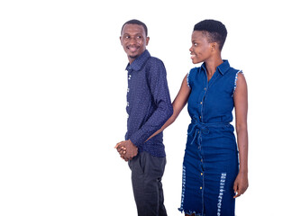 beautiful young couple in love holding hands walking together smiling.