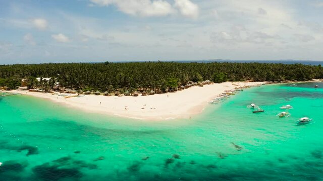 Tropical landscape: Daco island with beautiful beach, palm trees by turquoise water view from above. Siargao, Philippines. Summer and travel vacation concept