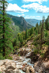 Fototapeta na wymiar A gorgeous view of a waterfall in the mountains in Yosemite National Park, California.