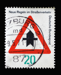 Stamp printed in Germany dedicated to New traffic rules, shows a road sign "Proceed with caution", circa 1971