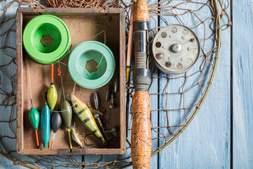 Vintage fishing tackle with rod and lures. Fishing preparation
