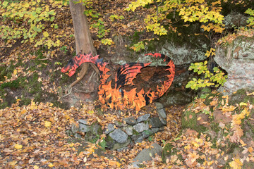 dragon in front of cave