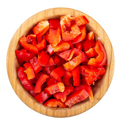 Sliced red bell pepper in a wooden bowl isolated on white background. Fresh and healthy vegetables....