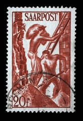 Stamp from Germany area Saar shows Building workers, circa 1948