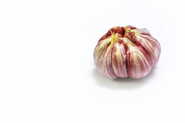 Head of garlic on white background spins. isolate