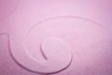 Fototapeta na wymiar Extreme macro of embossed pink paper
