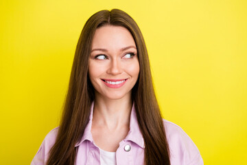 Portrait of attractive cheery curious girl looking aside overthinking copy blank space isolated over bright yellow color background