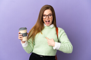 Teenager student girl over isolated purple background with surprise facial expression