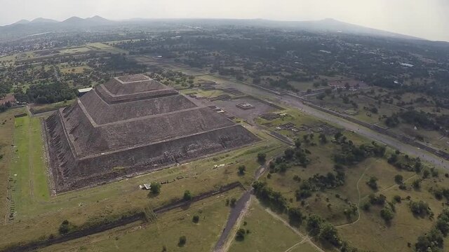 the world's third largest pyramid, the pyramid of the Sun in Teotihuacan with ruin walls in the foreground on a rare smog free day (aerial photography)