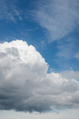 Naklejka na ściany i meble closeup og big cumulo nimbus cloud in the blue sky background