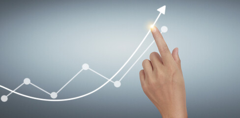 Hand touching graphs of financial indicator and accounting market  chart