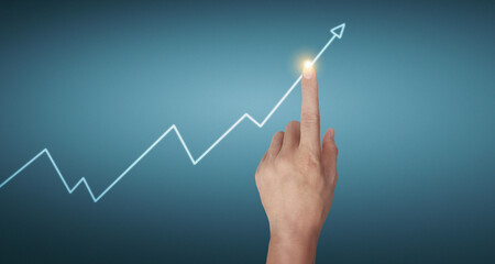 Hand touching graphs of financial indicator and accounting market  chart
