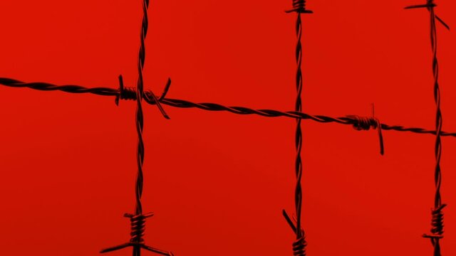 Barbed Wire Fence Dark On Red Sky