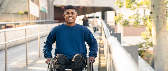 portrait of disabled black man smiling and looking at camera.