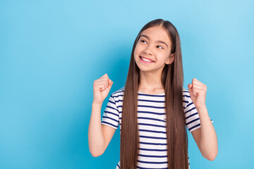 Photo of young cheerful girl happy positive smile rejoice victory fists hands look empty space...