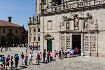 Santiago de Compostela, Spain; june 25, 2021: Tourists and pilgrims waiting in line to enter the...