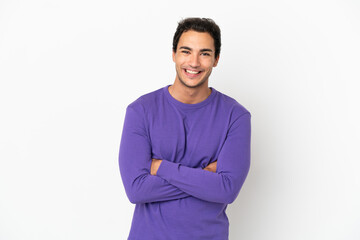 Caucasian handsome man over isolated white background keeping the arms crossed in frontal position