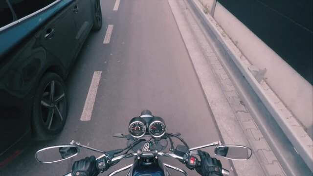 Motorcycle in motion. First-person view. Driving along the lane for cyclists, marked with special markings. Stop in front of the crosswalk in front of the zebra crossing. Driver's license exam.